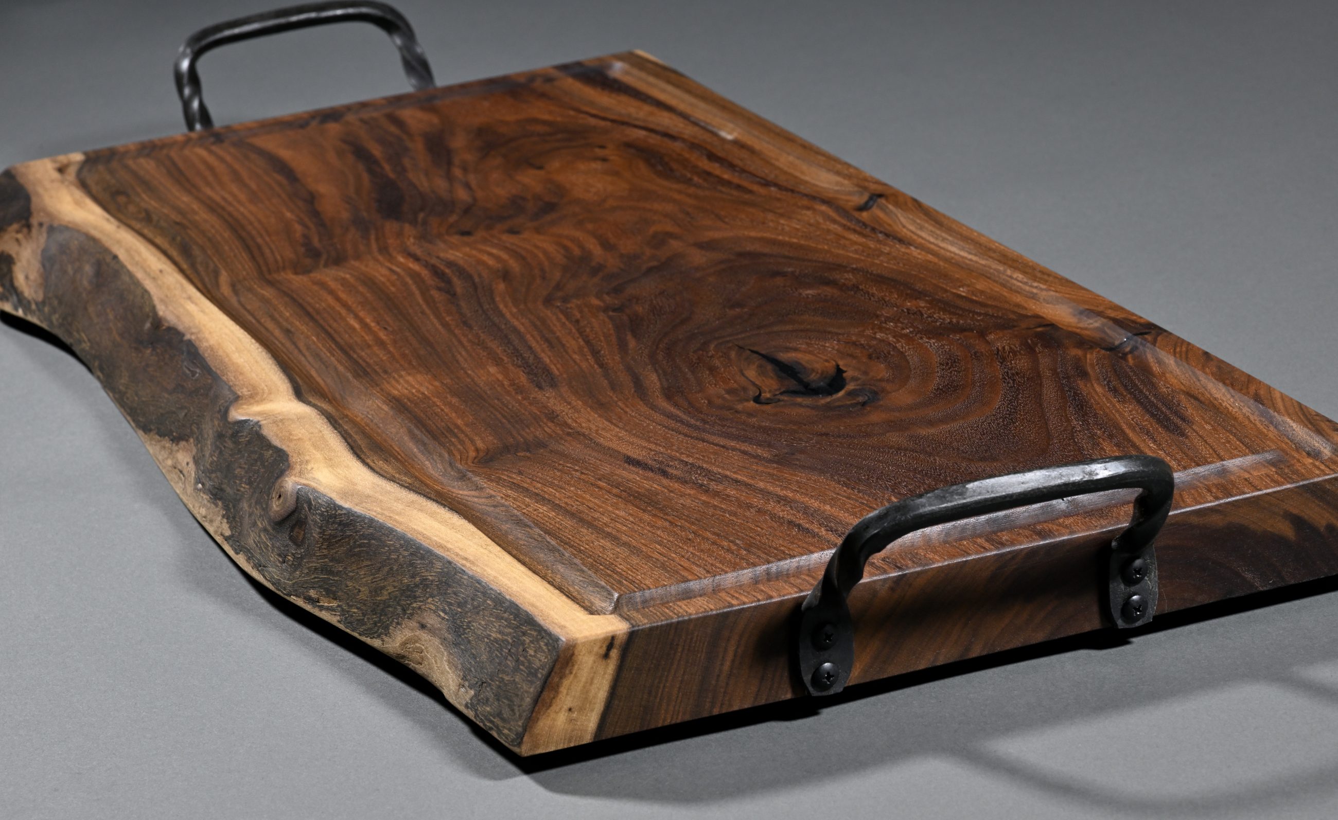 Side view showing hand forged handles and edge detail
