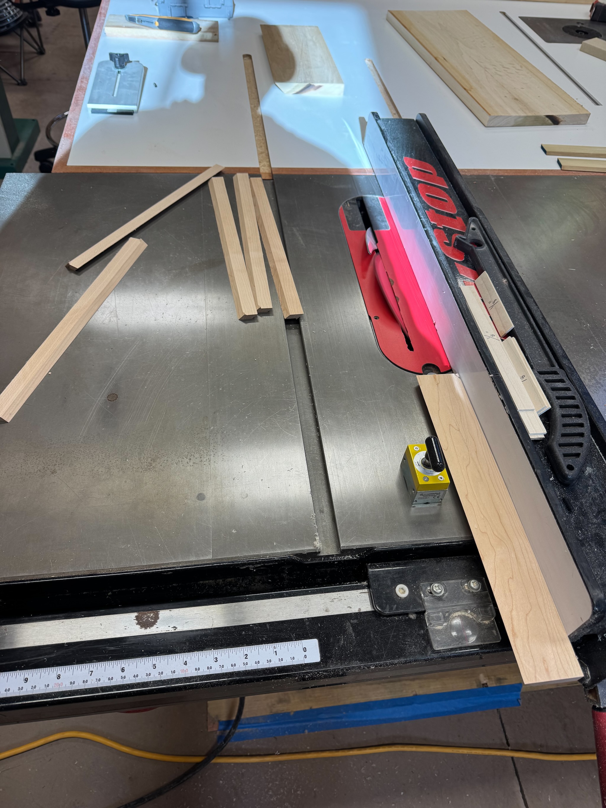Magnetic stop on table saw